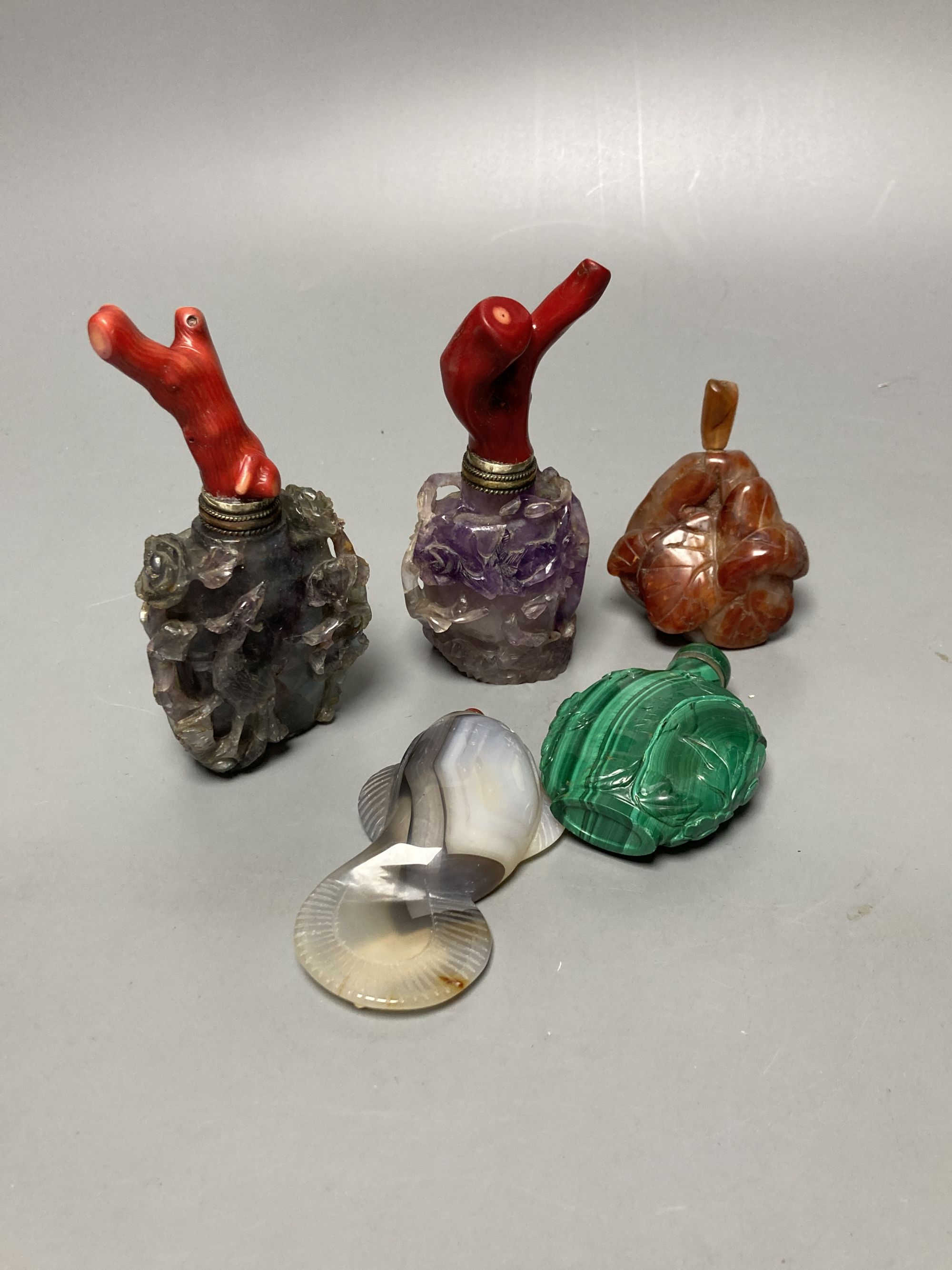 Five Chinese carved hardstone snuff bottles